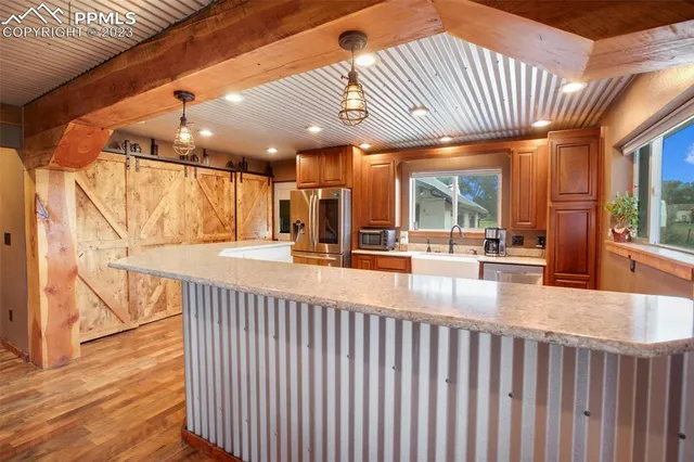 a view of a patio with a table and chairs