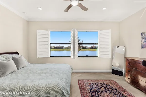 a bedroom with furniture and window