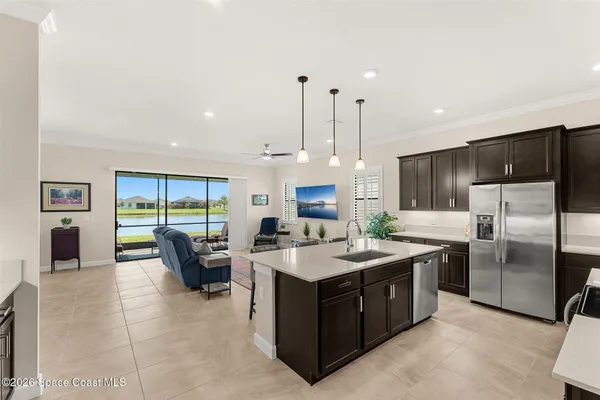 a large kitchen with kitchen island a large counter top