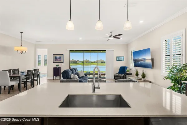 a view of a living room and chandelier
