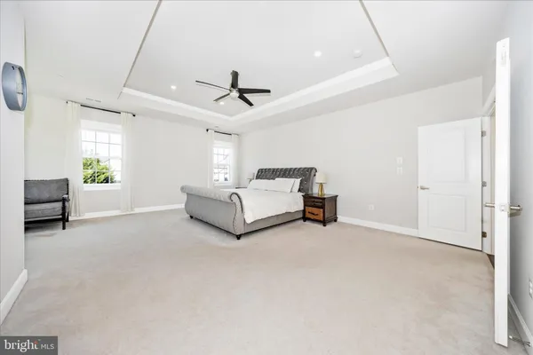 a spacious bathroom with a double vanity sink mirror and toilet