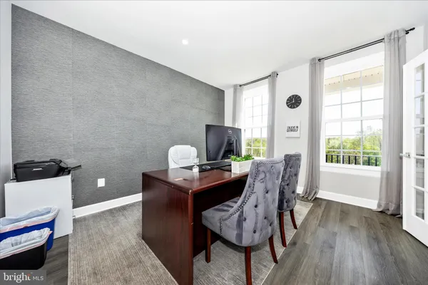 a workspace with furniture and wooden floor