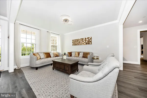 a living room with furniture or couch and a window