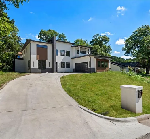 a view of a house with pool in front of it