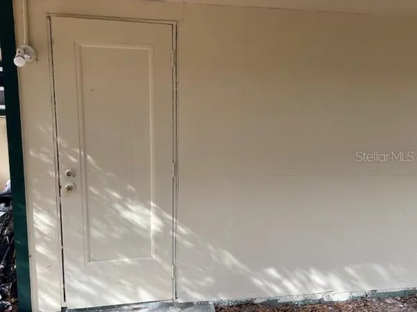 a bathroom with a glass shower door
