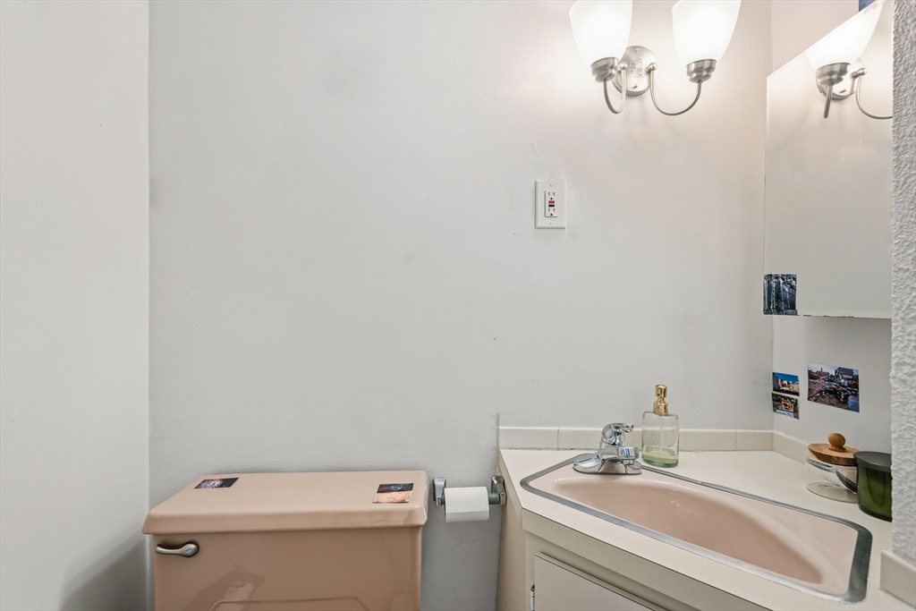 55 Sewall Avenue, Unit 1C Brookline, MA 02446 - Photo 13 of 16 a bathroom with a sink and a toilet