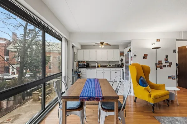 a view of a dining room with furniture window and wooden floor