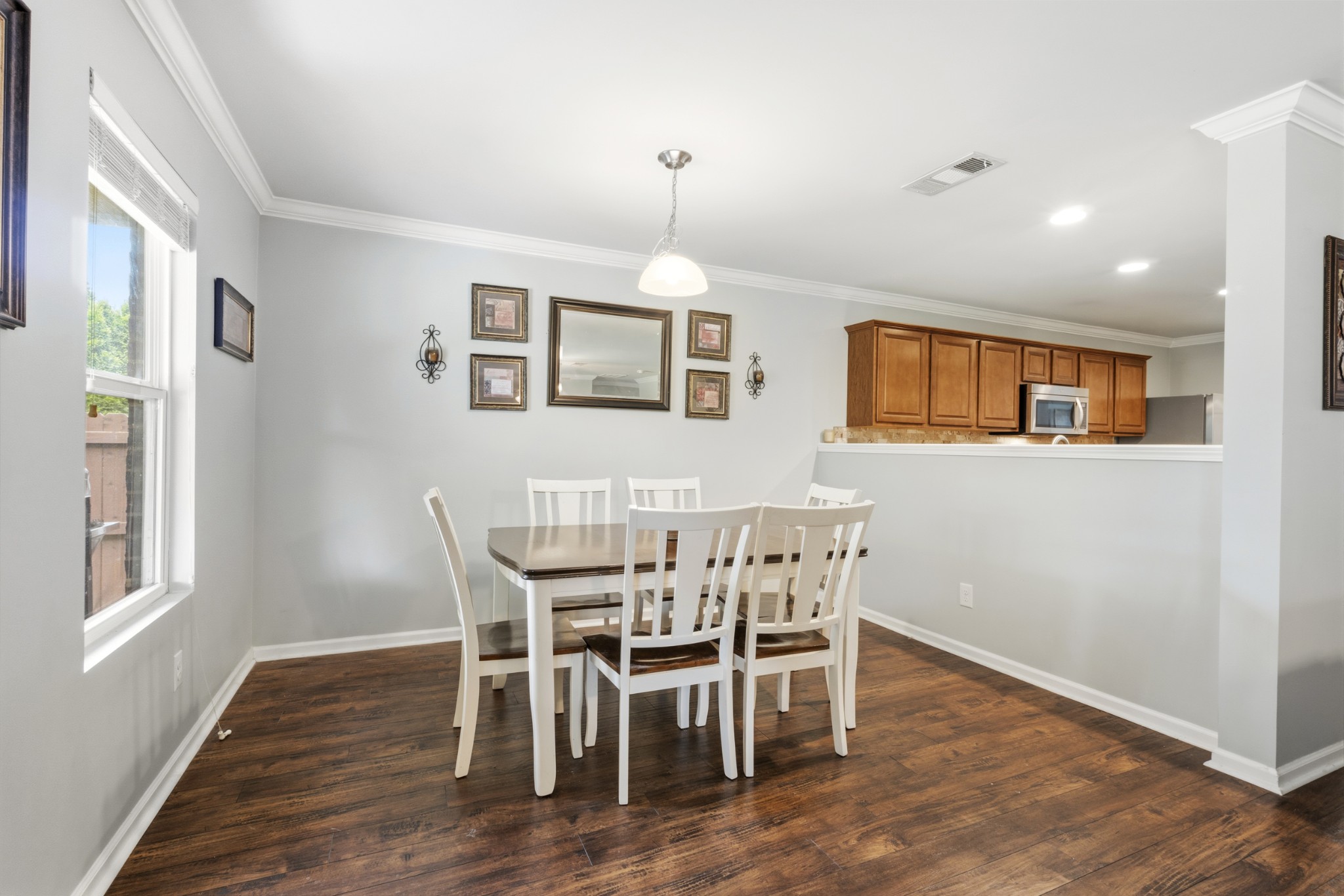 1011 Benwick Road Hendersonville, TN 37075 - Photo 23 of 60 a dining room with furniture a chandelier and wooden floor
