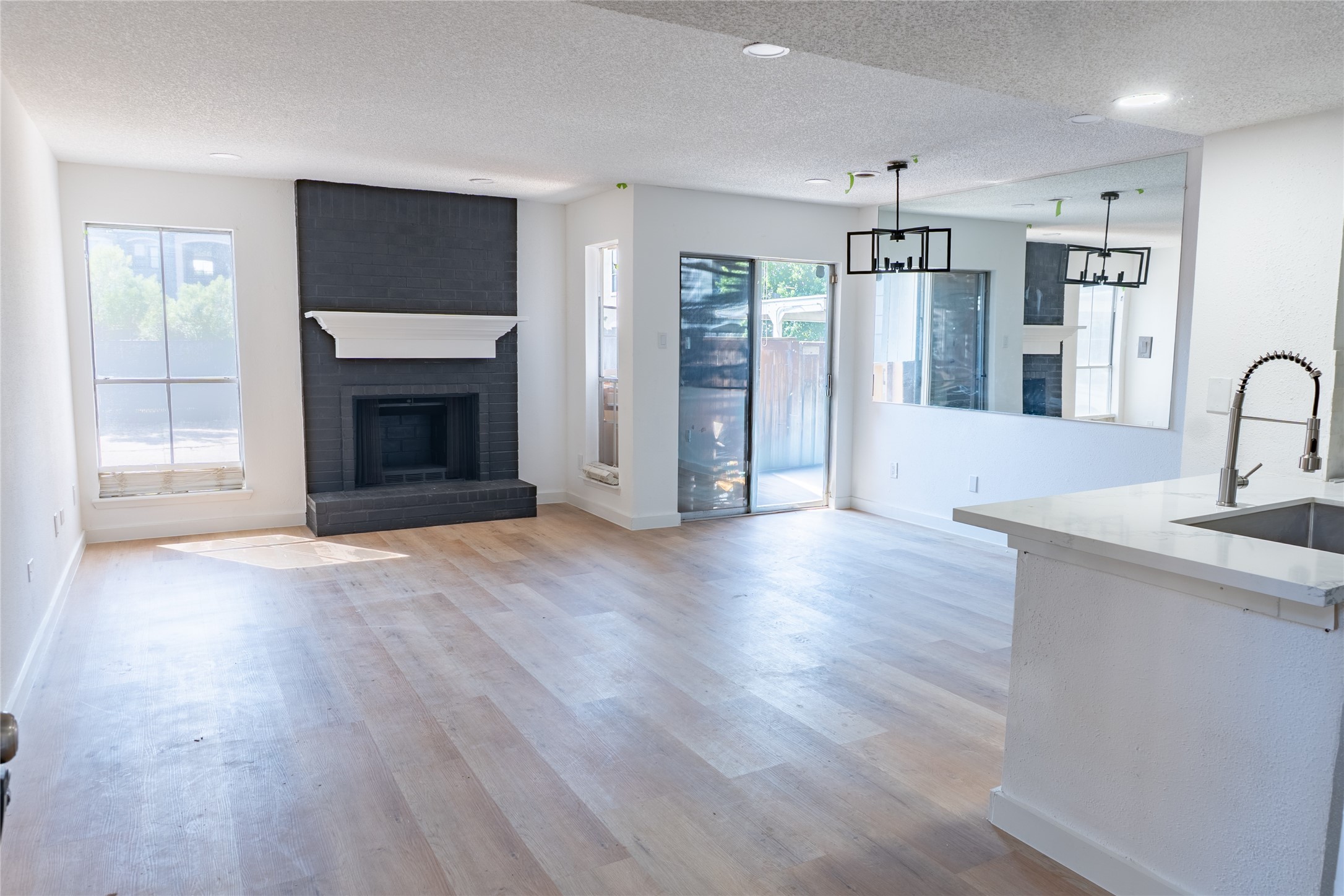 a view of a kitchen cabinets and wooden floor