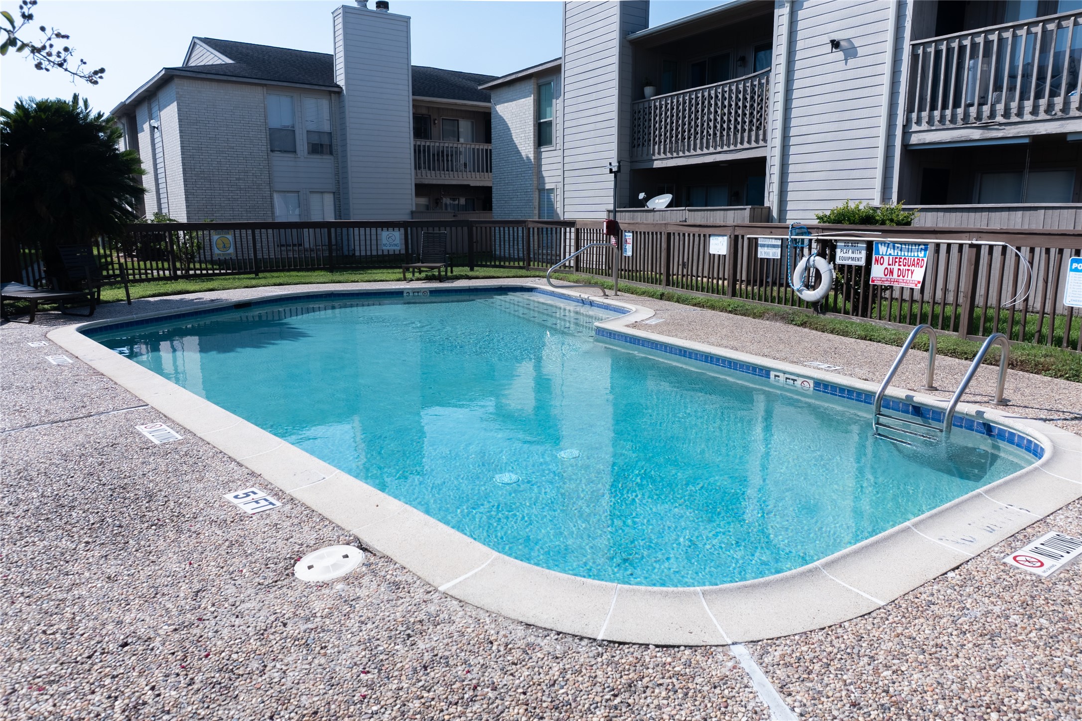 3919 Fairmont Parkway, Unit 129 Pasadena, TX 77504 - Photo 17 of 18 a view of a swimming pool with a patio