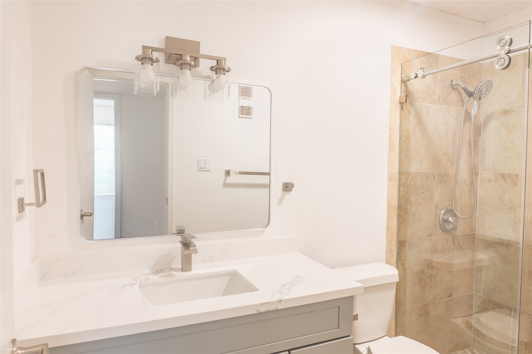 3919 Fairmont Parkway, Unit 129 Pasadena, TX 77504 - Photo 10 of 18 a bathroom with a sink a toilet and shower