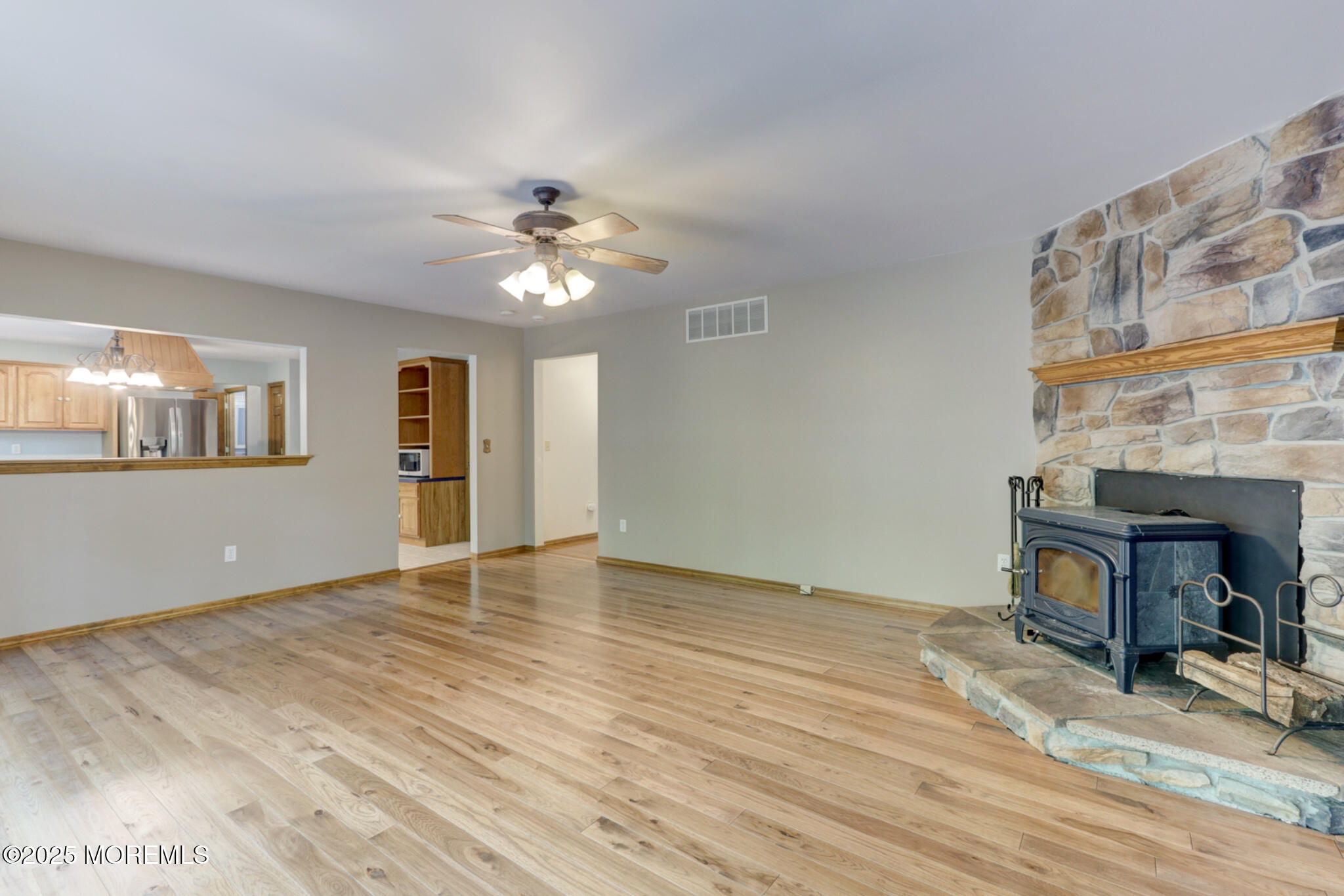 143 Siloam Road Freehold, NJ 07728 - Photo 11 of 55 a view of an empty room with a window and a kitchen