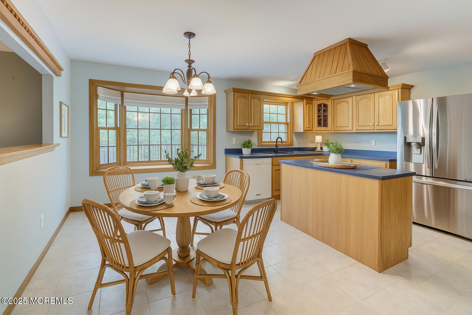143 Siloam Road Freehold, NJ 07728 - Photo 12 of 55 a kitchen with stainless steel appliances granite countertop a kitchen island a stove a table and chairs