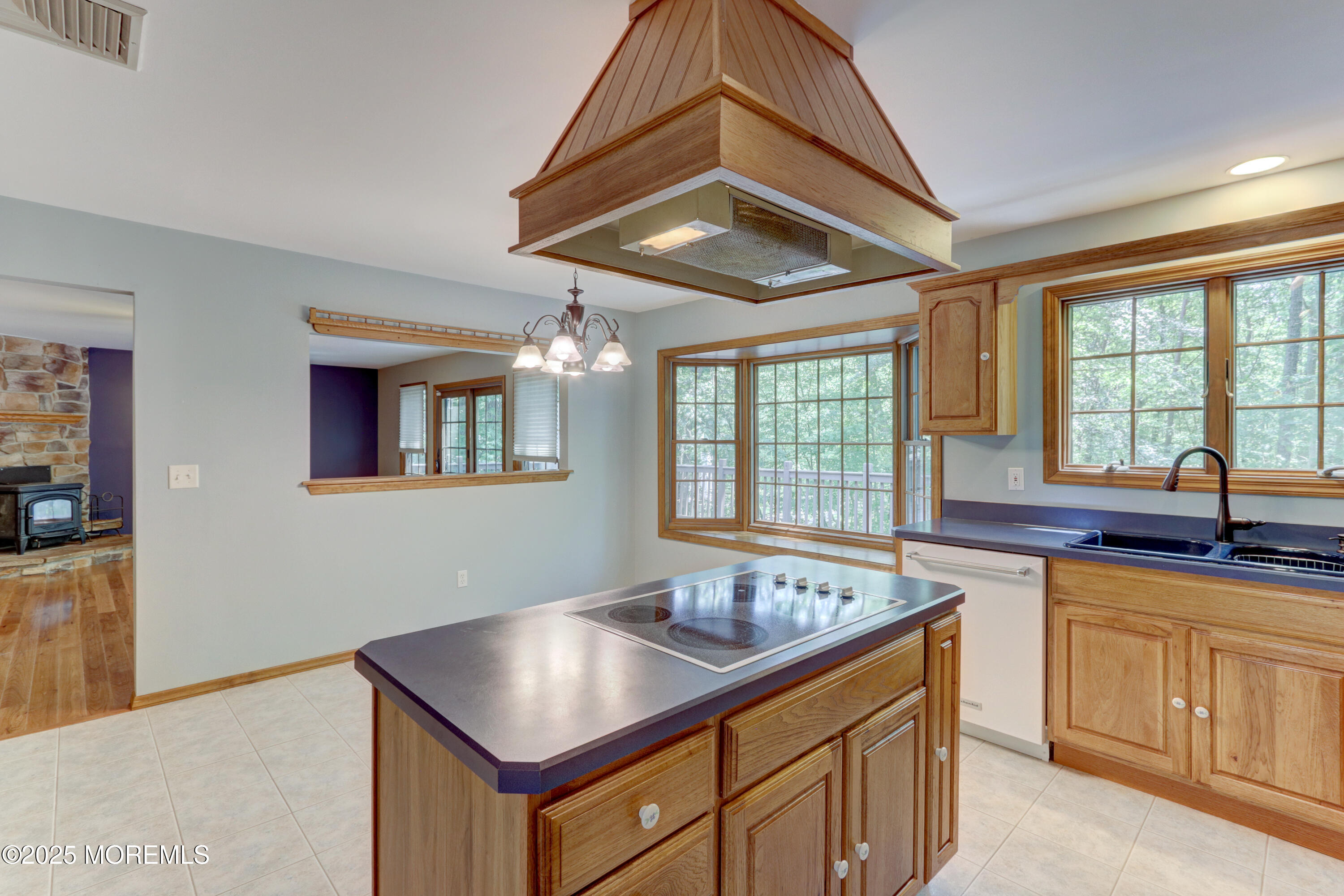 143 Siloam Road Freehold, NJ 07728 - Photo 15 of 55 a kitchen with a sink stove and cabinets