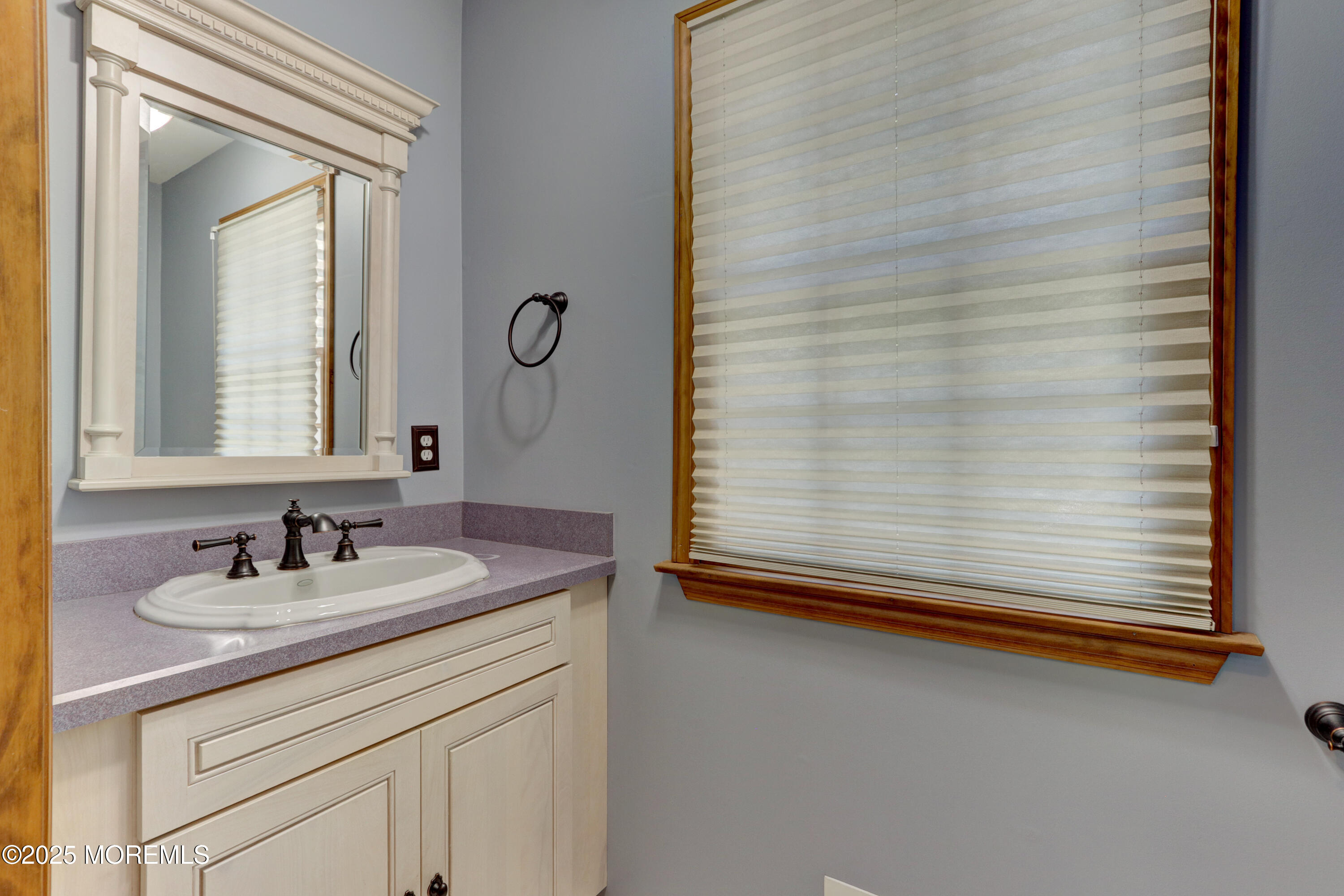 143 Siloam Road Freehold, NJ 07728 - Photo 16 of 55 a bathroom with a sink and a mirror