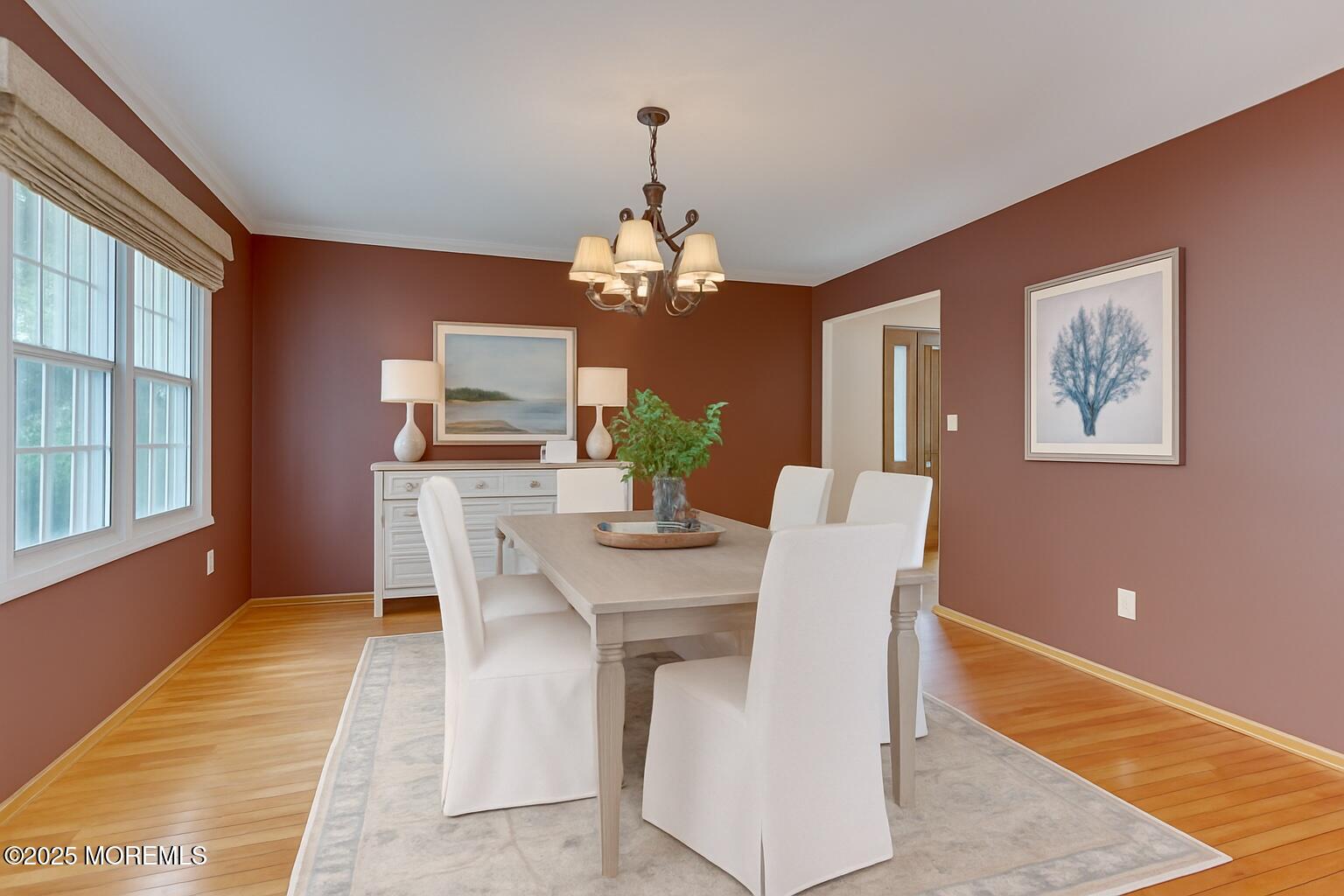 143 Siloam Road Freehold, NJ 07728 - Photo 18 of 55 a view of a dining room with furniture a chandelier and wooden floor