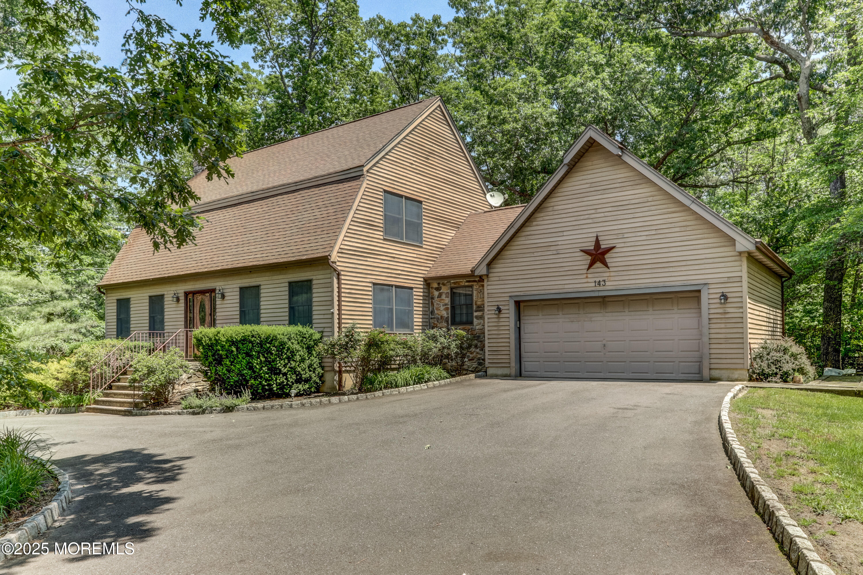 143 Siloam Road Freehold, NJ 07728 - Photo 2 of 55 a front view of house with yard and trees around