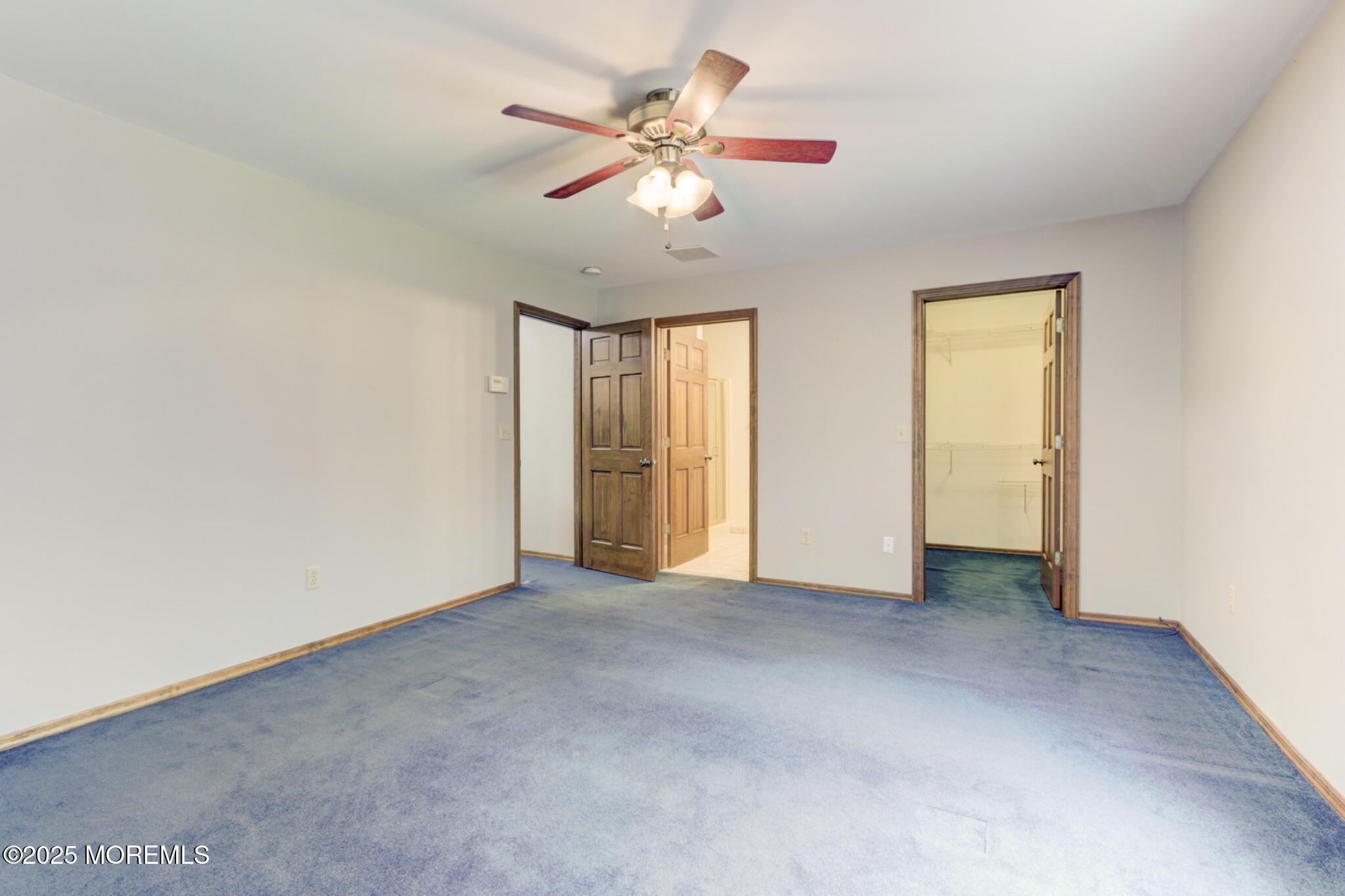 143 Siloam Road Freehold, NJ 07728 - Photo 23 of 55 an empty room with chandelier fan and windows