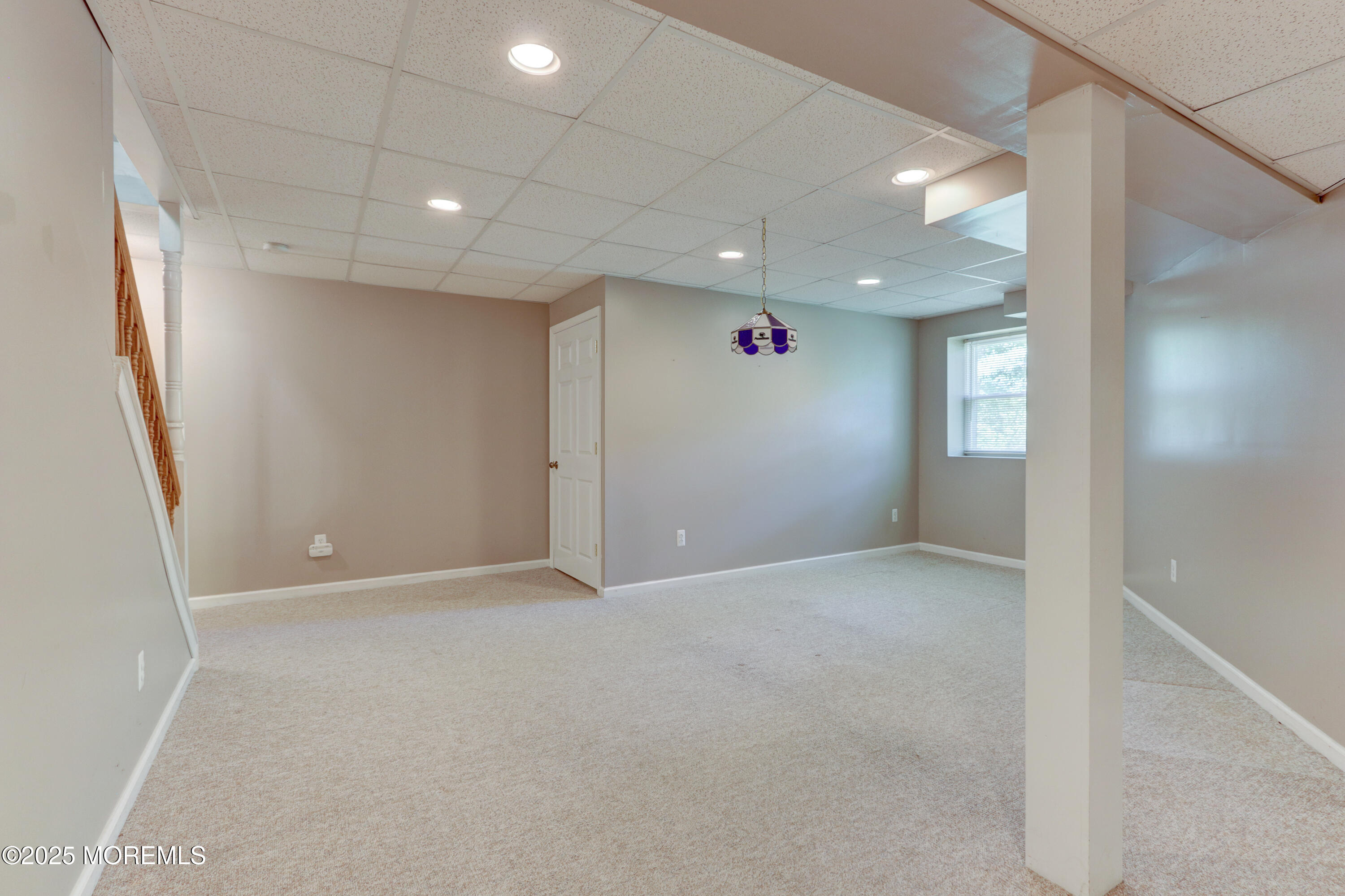 143 Siloam Road Freehold, NJ 07728 - Photo 33 of 55 an empty room with windows and refrigerator