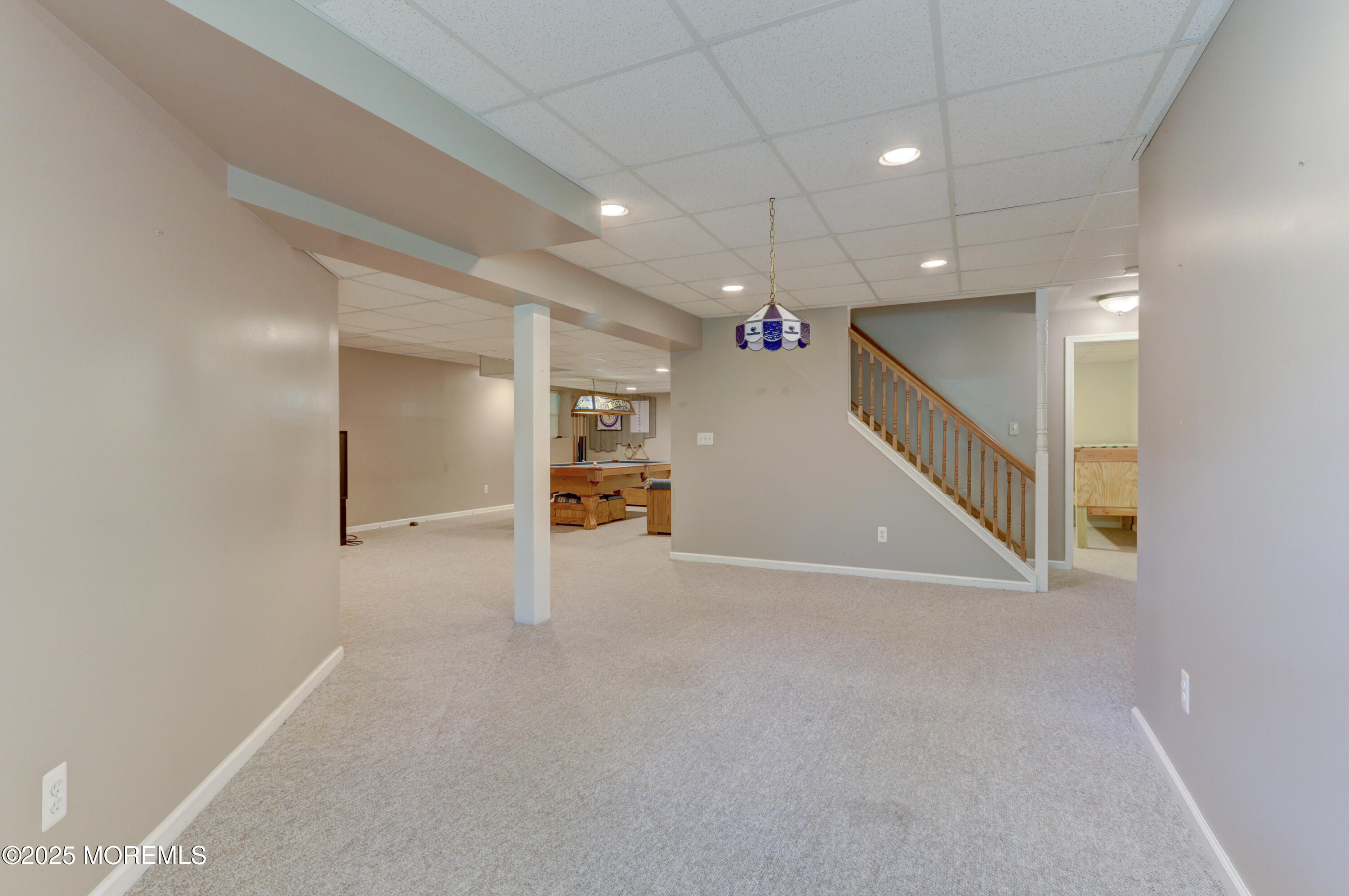 143 Siloam Road Freehold, NJ 07728 - Photo 34 of 55 a view of an empty room with a projector