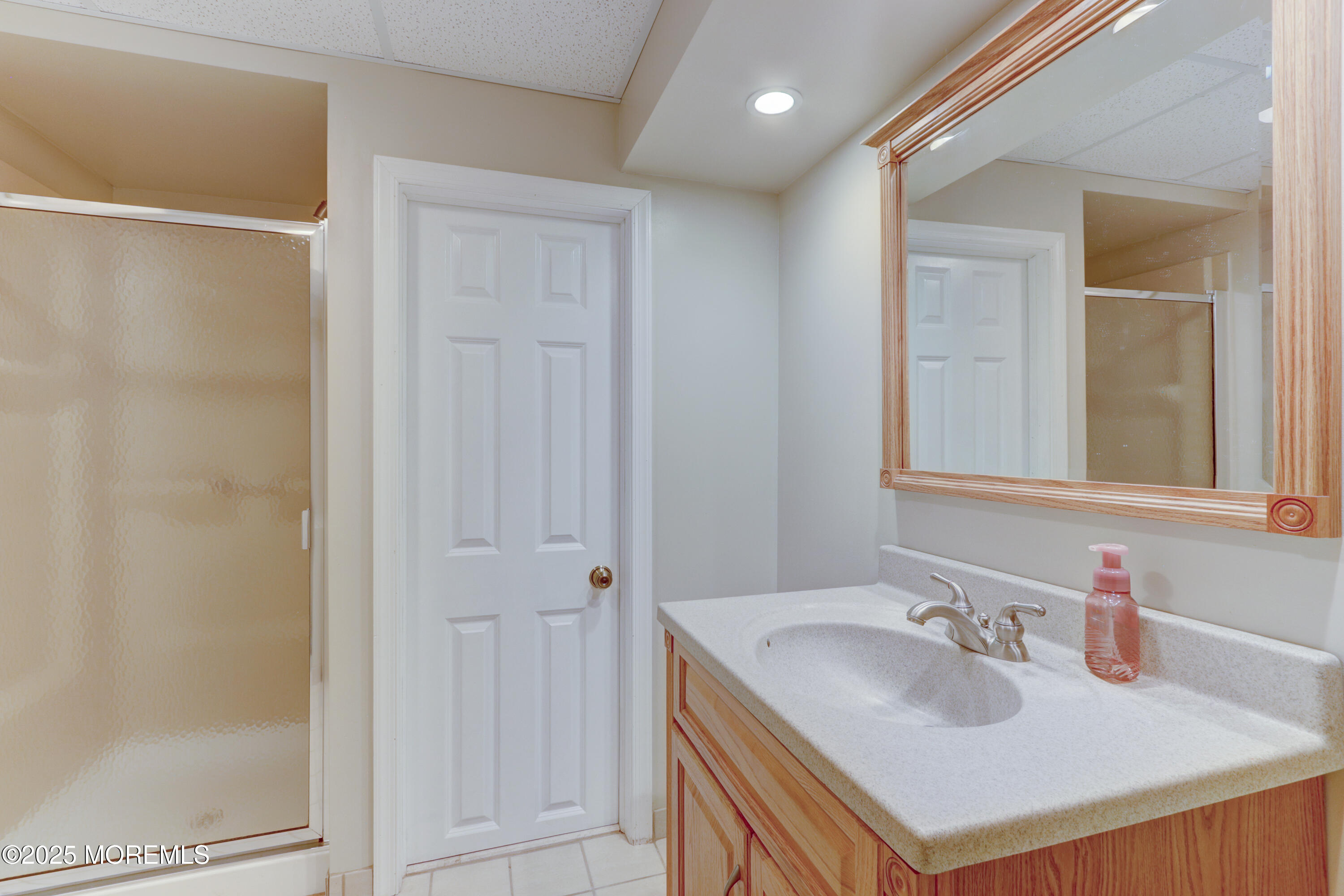 143 Siloam Road Freehold, NJ 07728 - Photo 38 of 55 a bathroom with a sink and a mirror