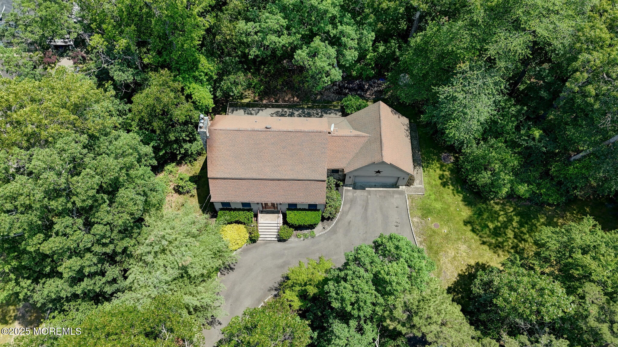 143 Siloam Road Freehold, NJ 07728 - Photo 49 of 55 an aerial view of a house with outdoor space and trees all around