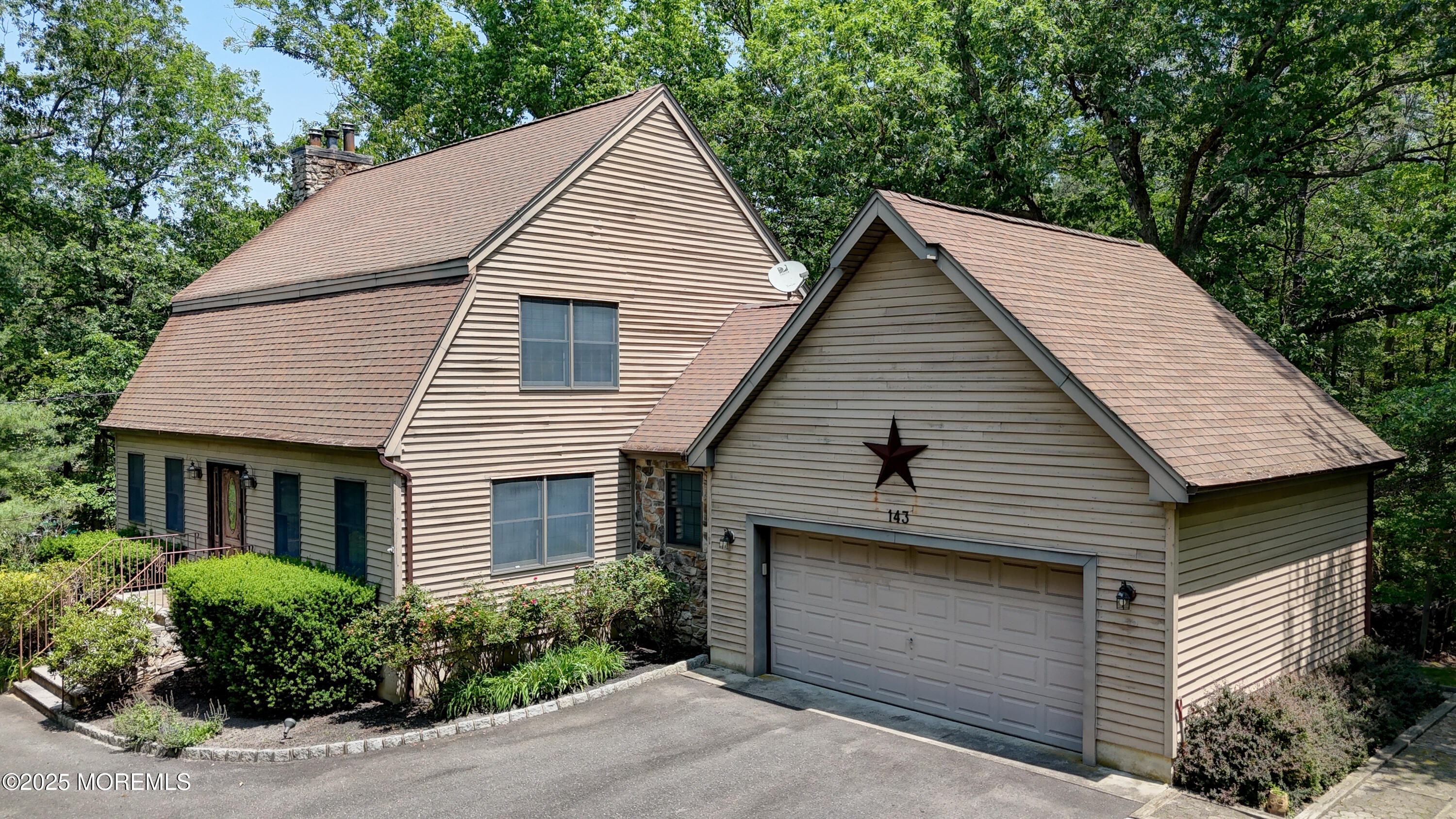 143 Siloam Road Freehold, NJ 07728 - Photo 50 of 55 a front view of a house with a garden