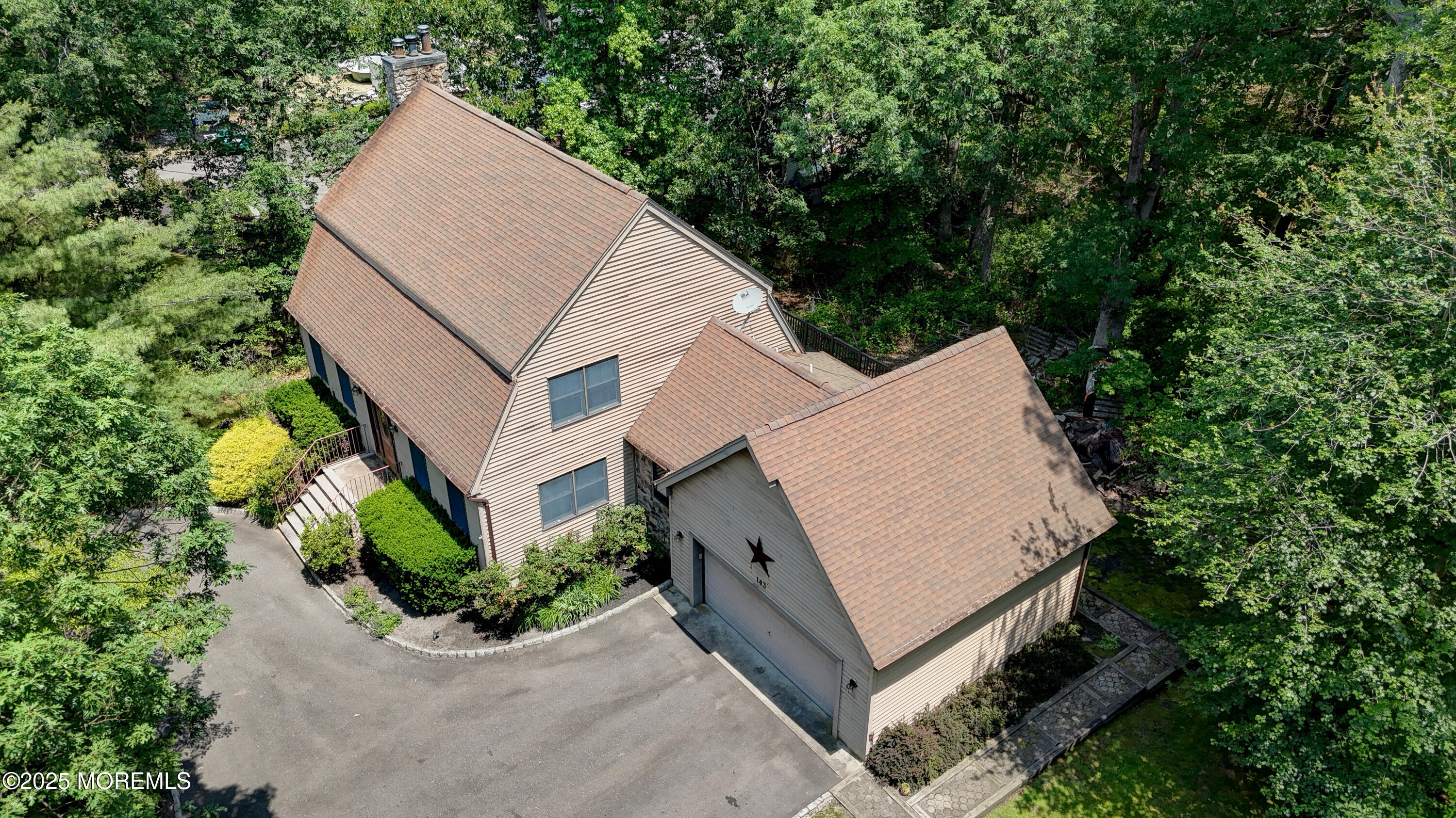 143 Siloam Road Freehold, NJ 07728 - Photo 51 of 55 an aerial view of a house with a yard and large trees