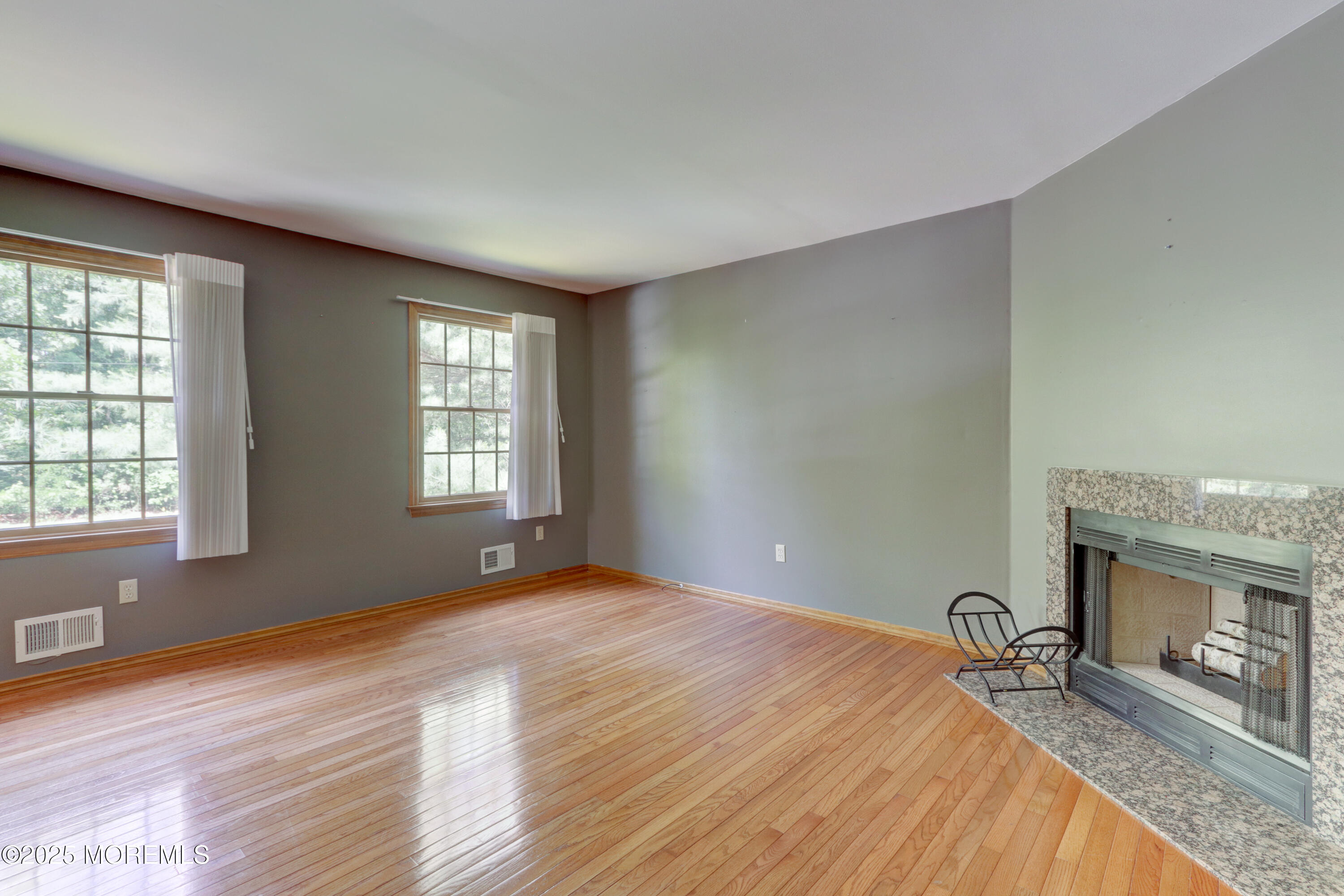 143 Siloam Road Freehold, NJ 07728 - Photo 7 of 55 a bedroom with a bed and a fireplace