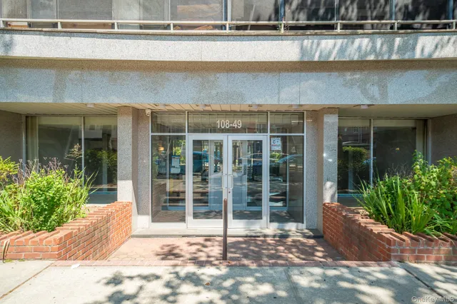 a view of a entrance door of the house with a yard