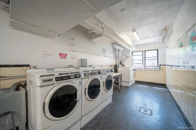 a view of a storage & utility room with washer and dryer