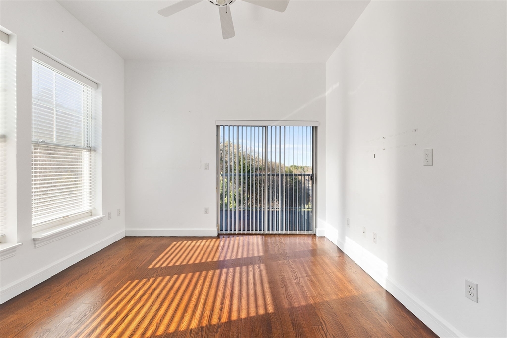 36 Village Road, Unit 715 Middleton, MA 01949 - Photo 13 of 32 wooden floor in an empty room with a window