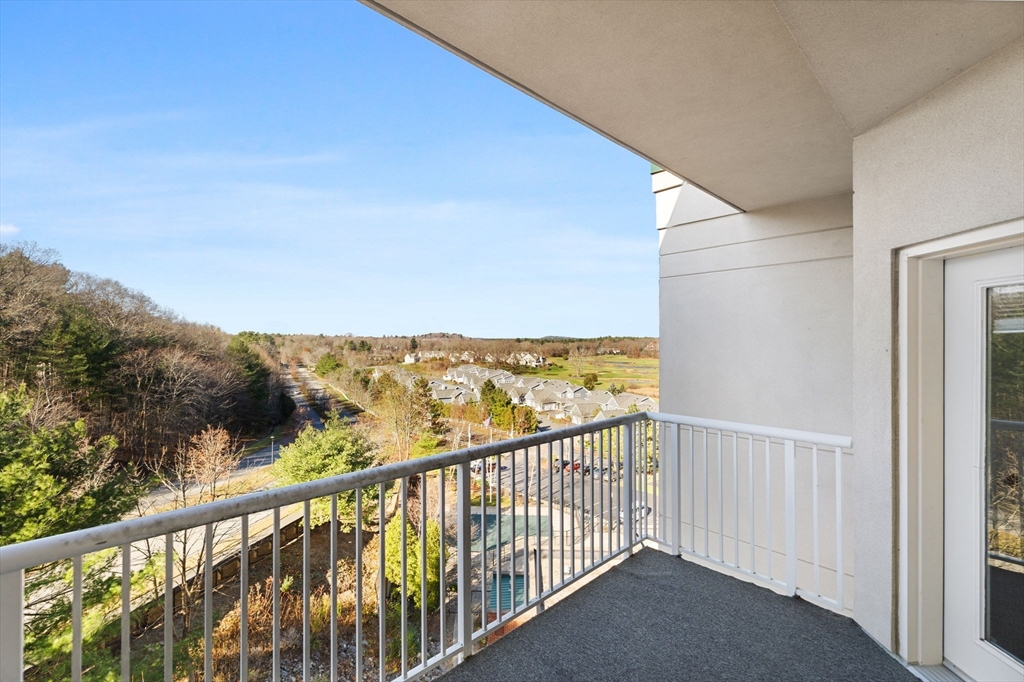 36 Village Road, Unit 715 Middleton, MA 01949 - Photo 14 of 32 a view of a balcony with an outdoor space