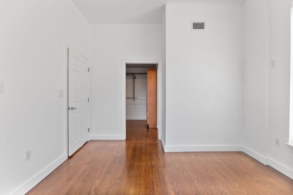 36 Village Road, Unit 715 Middleton, MA 01949 - Photo 15 of 32 a view of an empty room with wooden floor