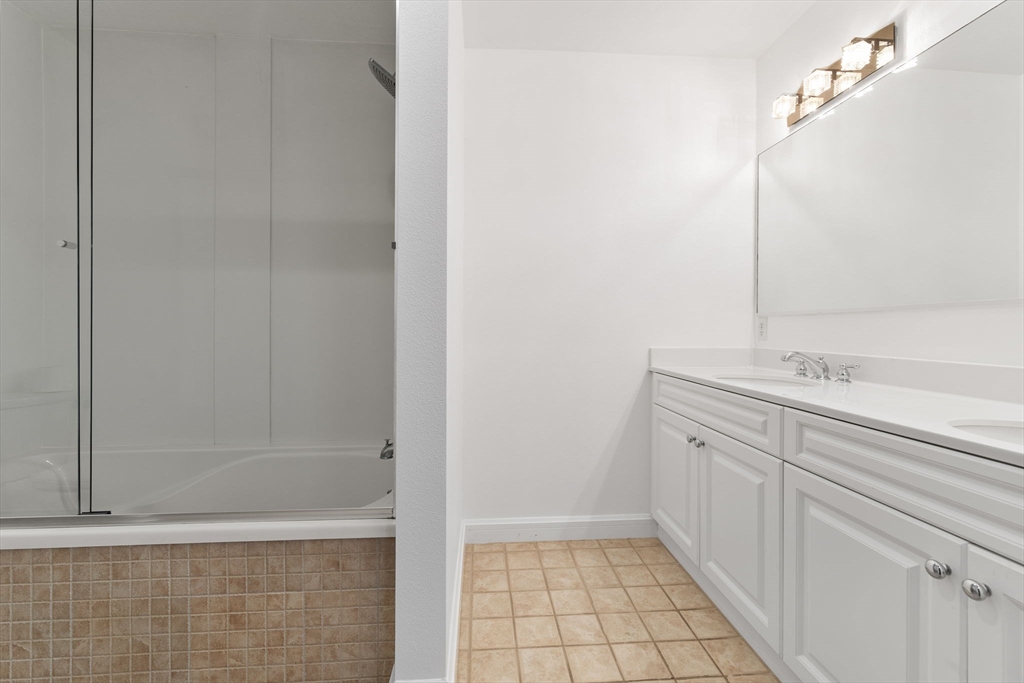 36 Village Road, Unit 715 Middleton, MA 01949 - Photo 18 of 32 a bathroom with a sink and a mirror