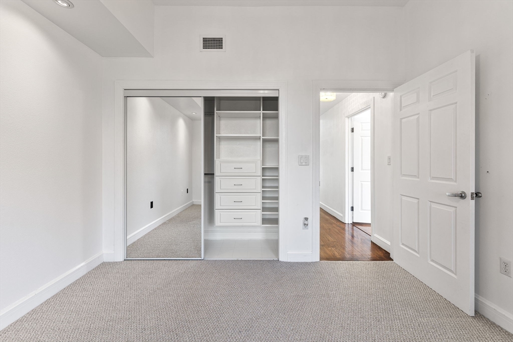 36 Village Road, Unit 715 Middleton, MA 01949 - Photo 22 of 32 an empty room with walk in closet and closet