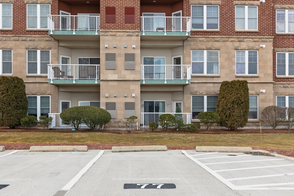 36 Village Road, Unit 715 Middleton, MA 01949 - Photo 32 of 32 a view of building with a swimming pool