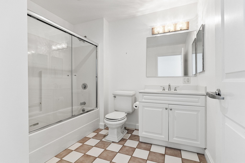 36 Village Road, Unit 715 Middleton, MA 01949 - Photo 8 of 32 a bathroom with a sink a toilet and shower