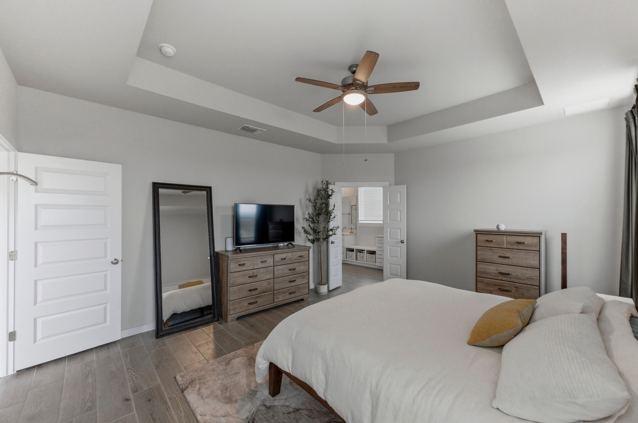 1209 Bluewood Bend Leander, TX 78641 - Photo 17 of 40 a bedroom with a bed and a flat screen tv