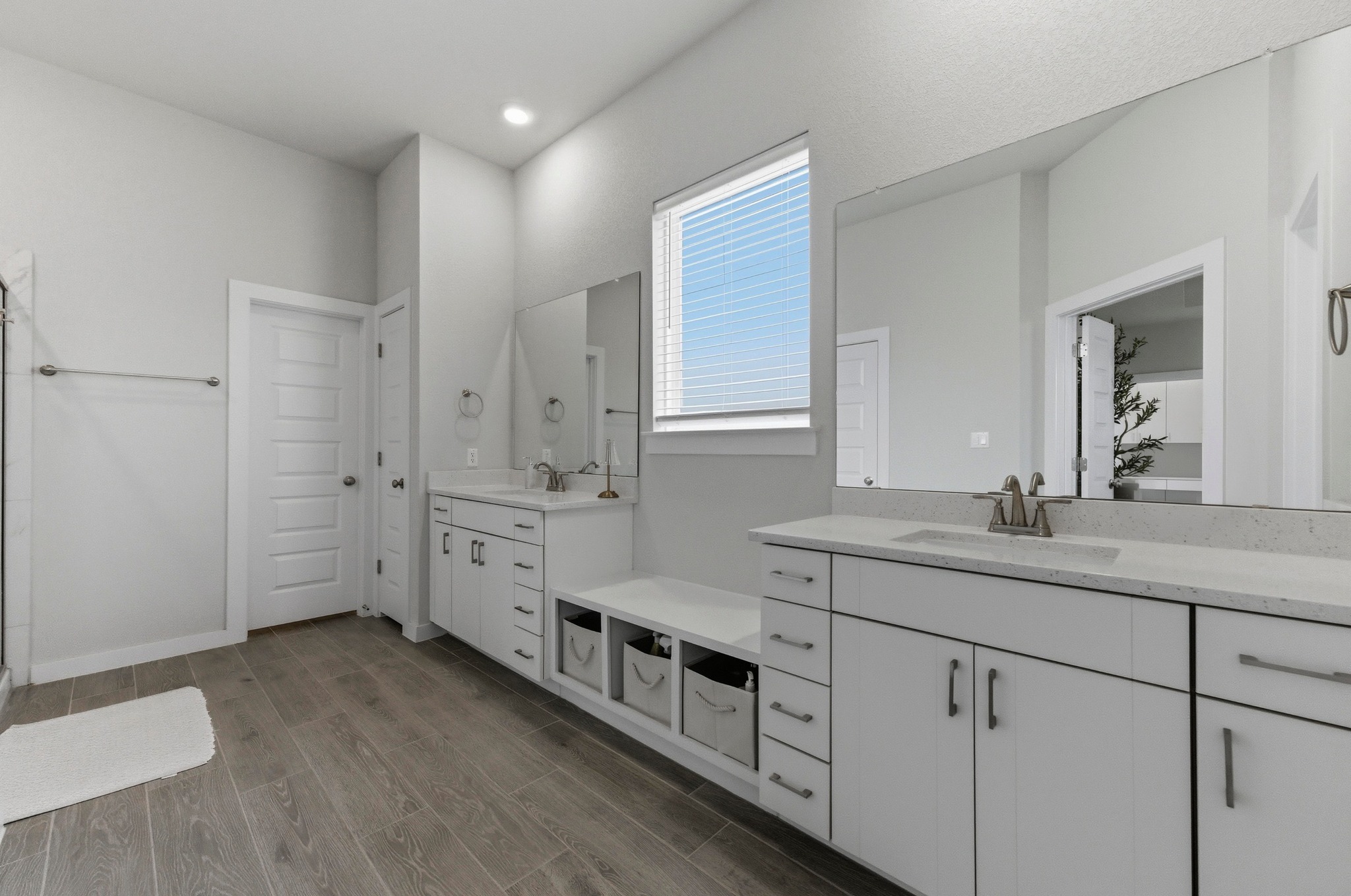 1209 Bluewood Bend Leander, TX 78641 - Photo 19 of 40 a spacious bathroom with double sink large mirror and a shower