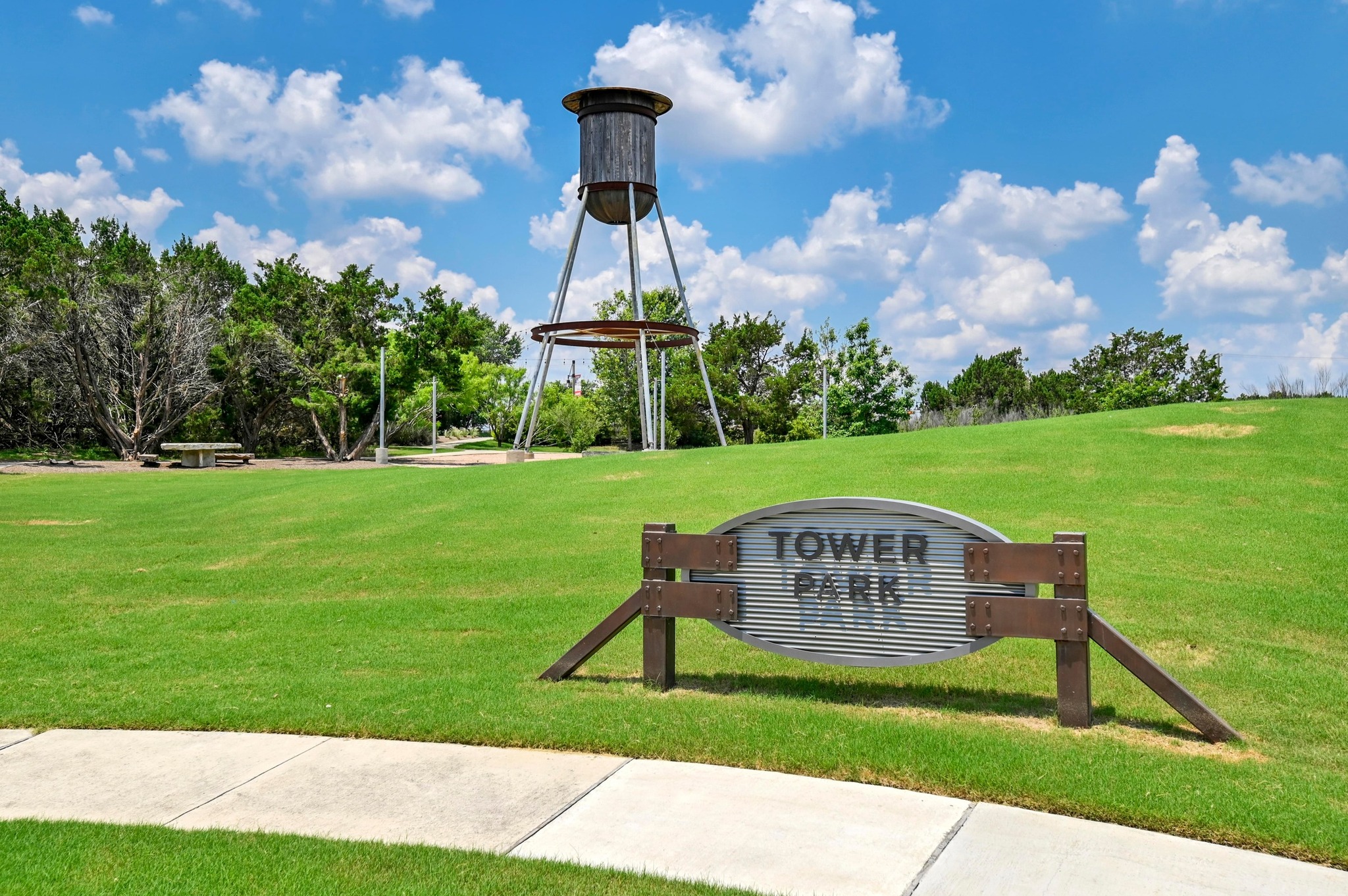 1209 Bluewood Bend Leander, TX 78641 - Photo 35 of 40 a view of a park with a bench in the background