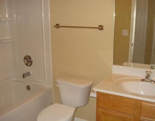 a view of an empty room with windows