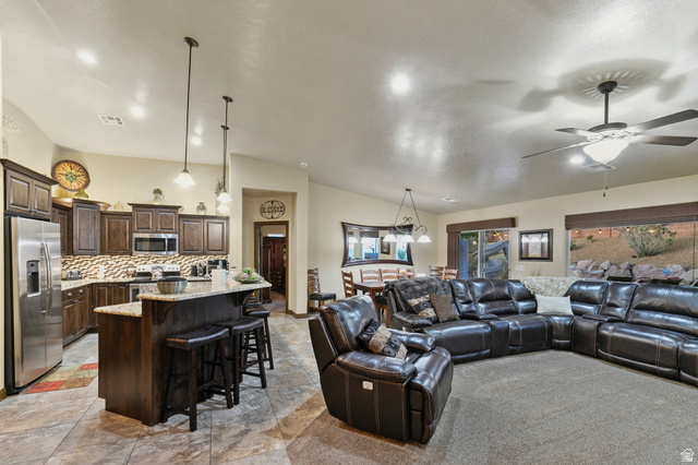 210 Talon Court Ivins, UT 84738 - Photo 10 of 60 Living area featuring lofted ceiling, ceiling fan, and recessed lighting