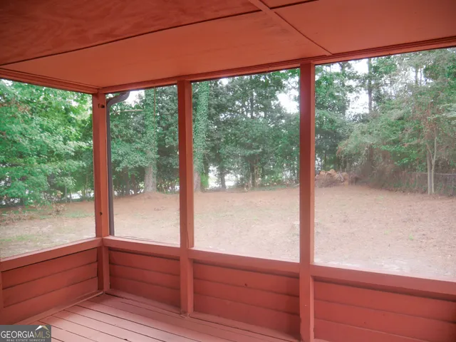 a view of a glass door and a yard