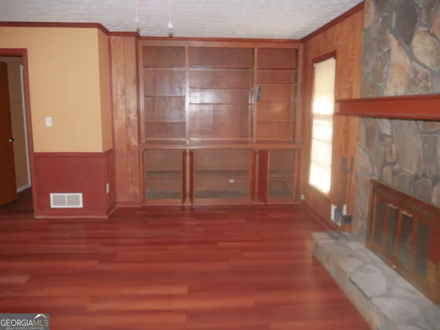 a view of a room with furniture and a window