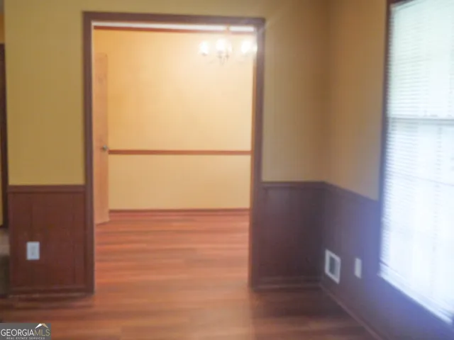 a bathroom with a shower and a sink