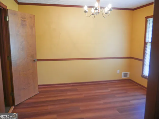 a view of a door of a house with a porch