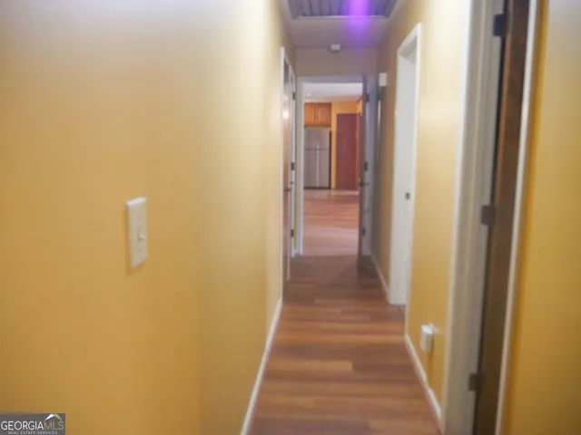 a view of a livingroom with wooden floor