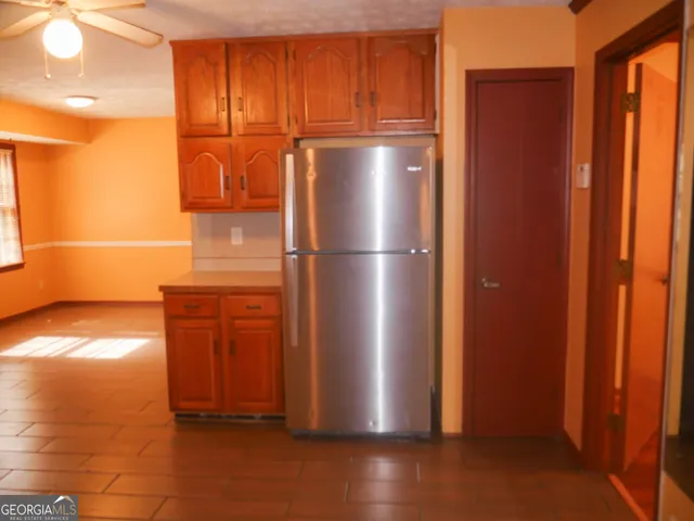 a kitchen with stainless steel appliances a sink stove and cabinets
