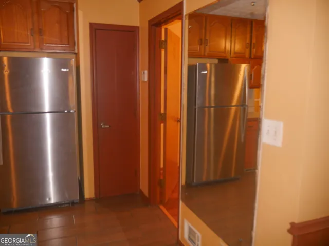 a view of a small space with wooden floor